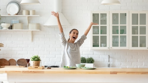 How do I disinfect my kitchen countertops naturally?